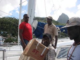 Image #37 - Hurricane Tomas Relief Effort (Carrying the goods to the distribution point)